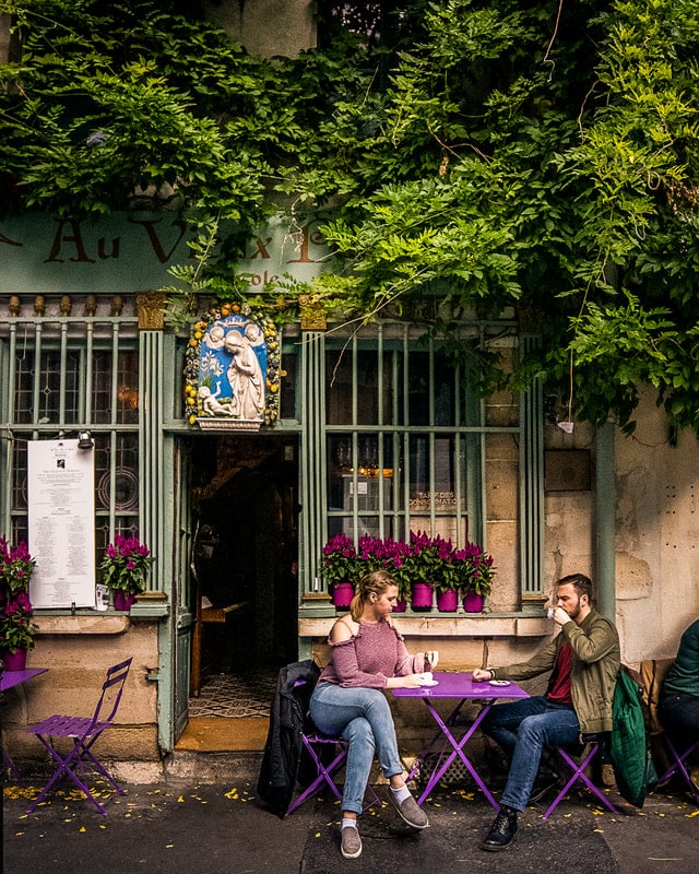 podcast 19 photo 1 Alysa and Jack at a café during ethical vegan travel in Paris
