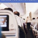 ext: Covid19 questions to ask your travel insurer before you buy a policy. A photo of the back of the seats on a plane.