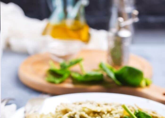 Vegan Pasta dish with oils set in front to top off with