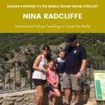 family of 4 standing and smiling. On the left a tall man, the children in the middle and the woman on the left. the childreen are a male and a female