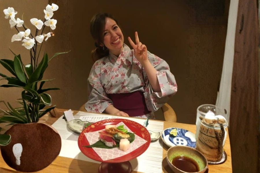 Woman in kimono enjoying vegan food in Kyoto Japan