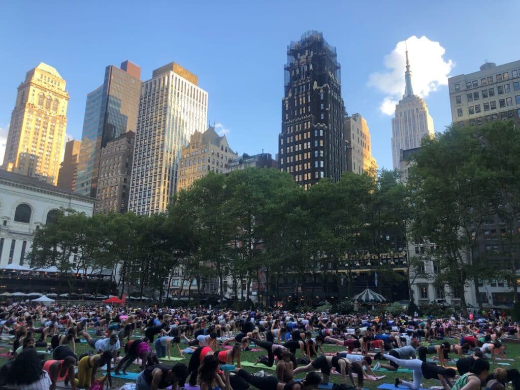 Number of people enjoying yoga in Bryant park, New York