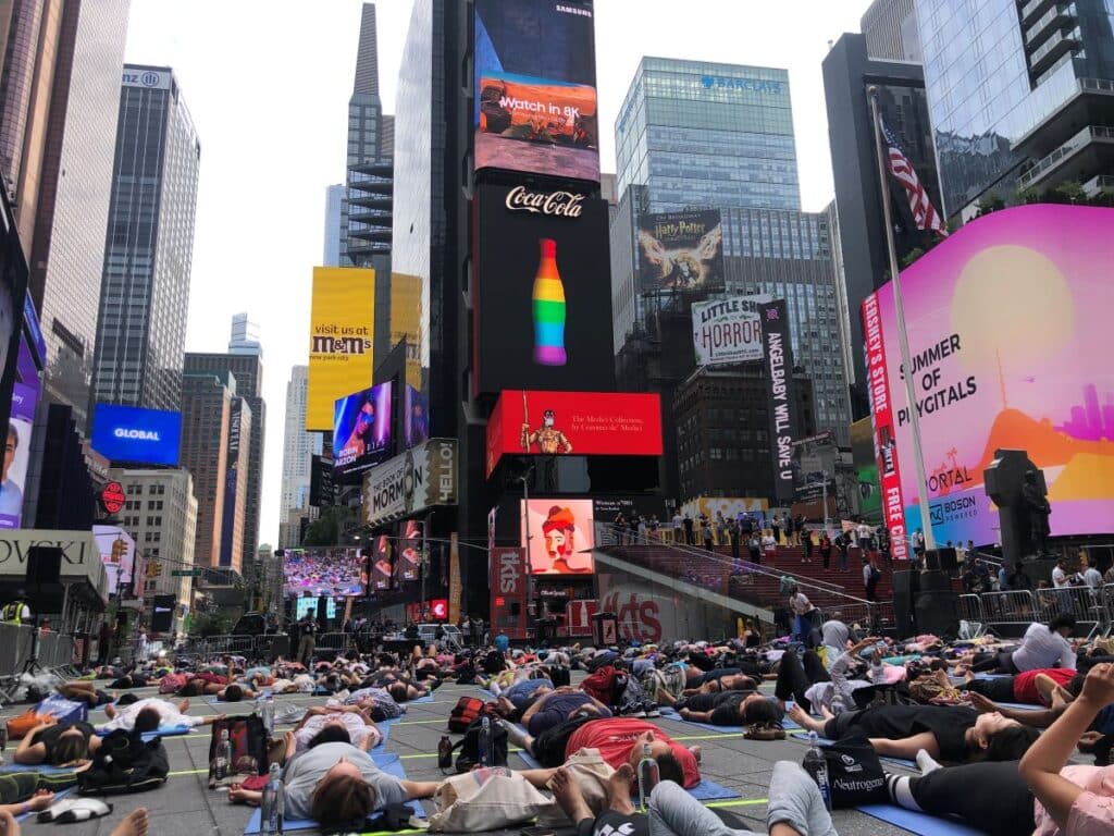 People enjoying yoga in Times Square
