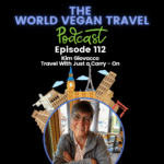 Female looking at the camera. TEXT. The World Vegan Travel Podcast Episode 112 Kim Giovacco Travel With Just a Carry - On