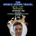 A man with short black hair and black eye is looking in the camera ;Exploring Sacramento: A Vegan's Delight with Rey Ortega