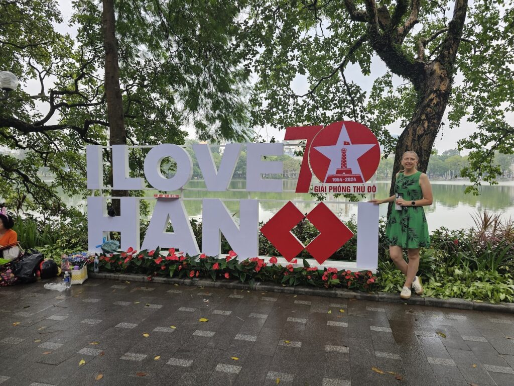 I Love Hanoi welcome sign in Hanoi, Vietnam with Founder of World Vegan Travel Brighde