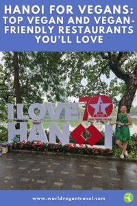 Cover page of blog: Hanoi for Vegans, featuring I love Hanoi Sign with Brighde Founder of World Vegan Travel