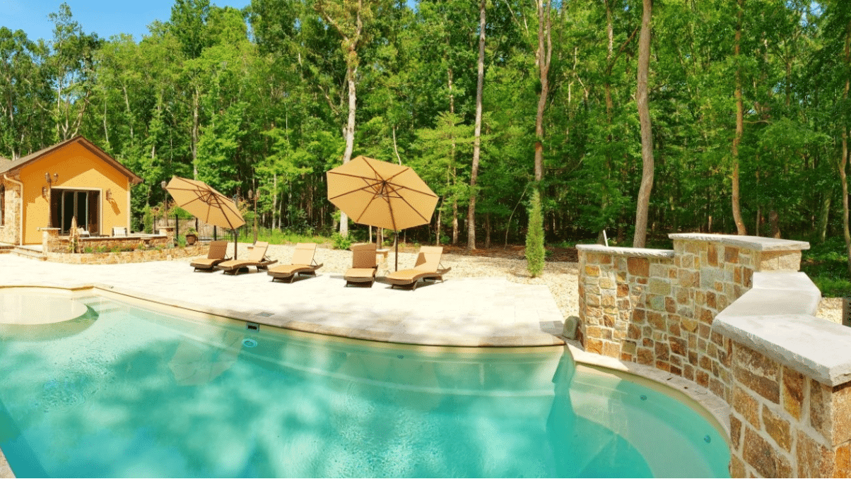 World Vegan Travel_villa with a pool and forest in the background