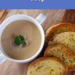 Bowl of creamy chickpea soup served with slices of toasted vegan garlic bread