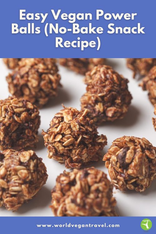 A close-up of easy vegan power balls made with oats and dates, shown on a white surface.