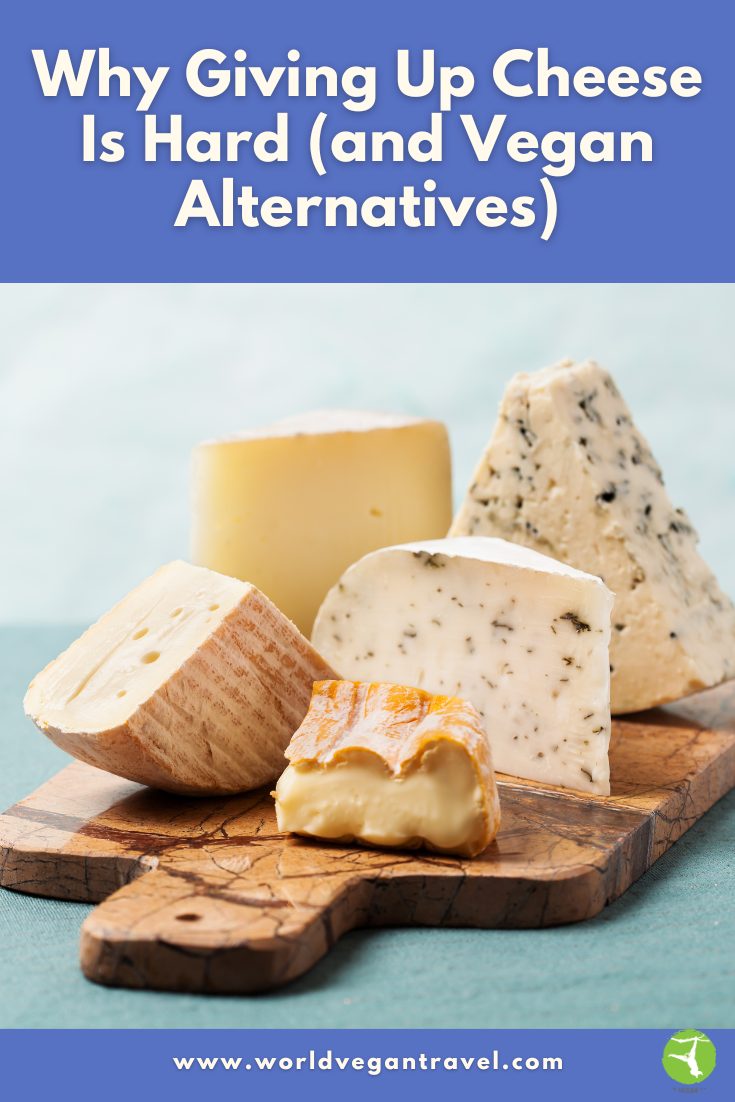 Different types of cheese on a wooden board to show why giving up cheese is hard and how vegan alternatives can help.