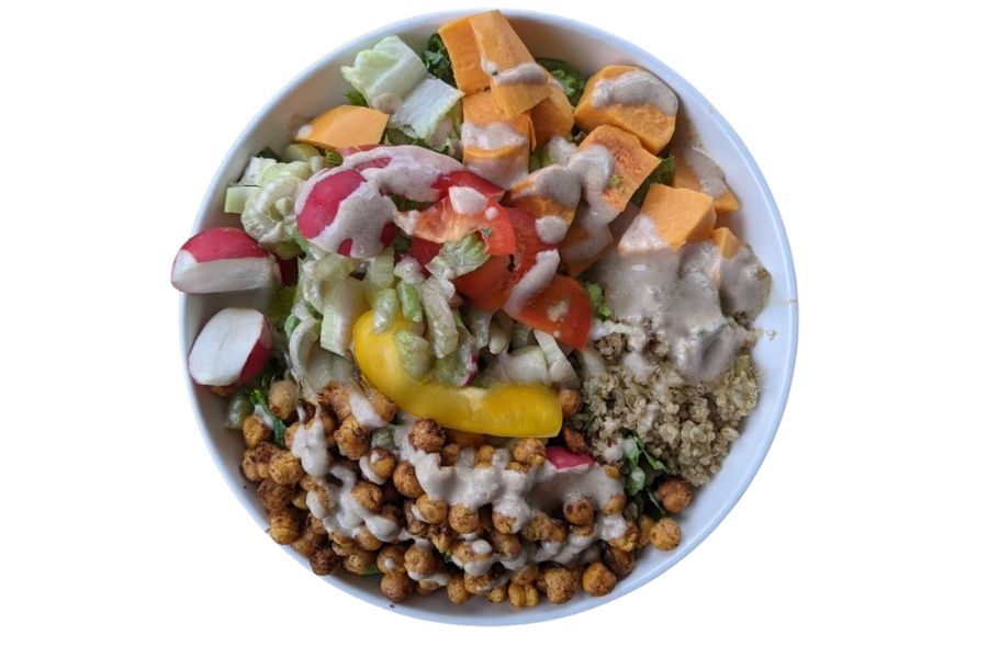 Colorful salad bowl topped with crunchy chickpeas as a tasty vegan topping.