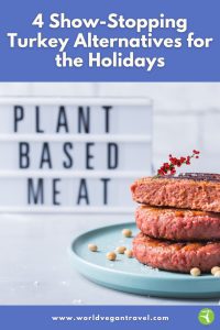 Stack of vegan plant-based burgers on a plate with a festive garnish.
