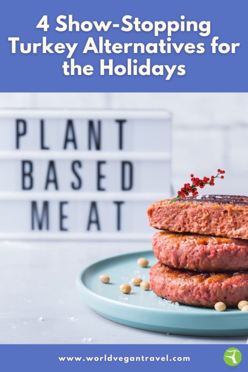 Stack of vegan plant-based burgers on a plate with a festive garnish.