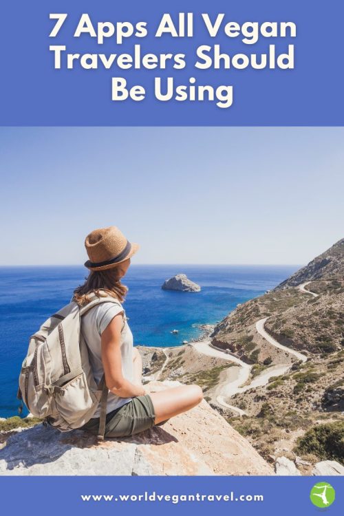 Vegan traveler with backpack enjoying ocean view on a cliff — 7 apps guide by World Vegan Travel