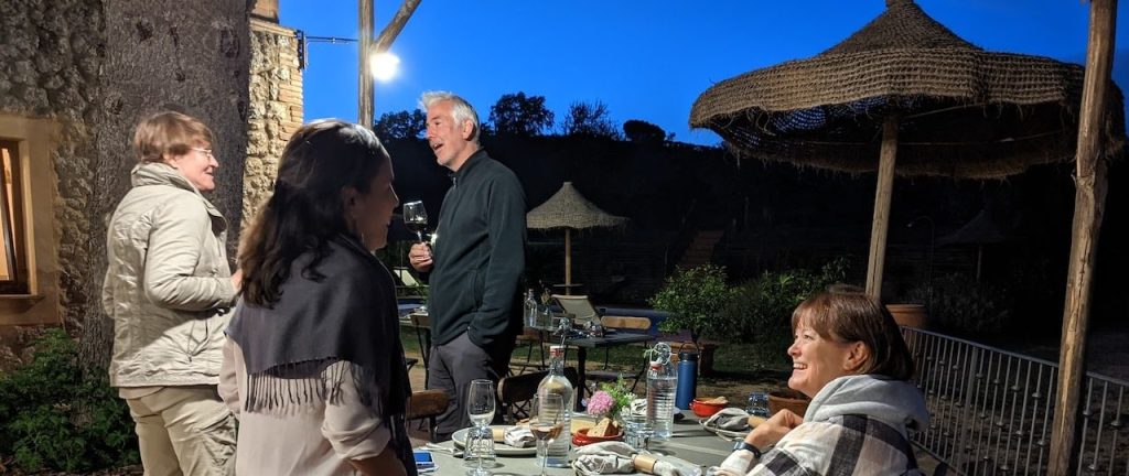 World Vegan Travel A group of people enjoying cools weather and good friends on a patio