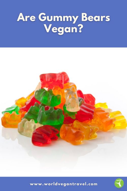 A heap of colorful gummy bears on a white surface