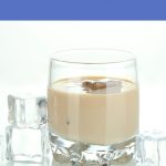 Glass of creamy Baileys-style liqueur on ice, showing what vegan Irish cream looks like.
