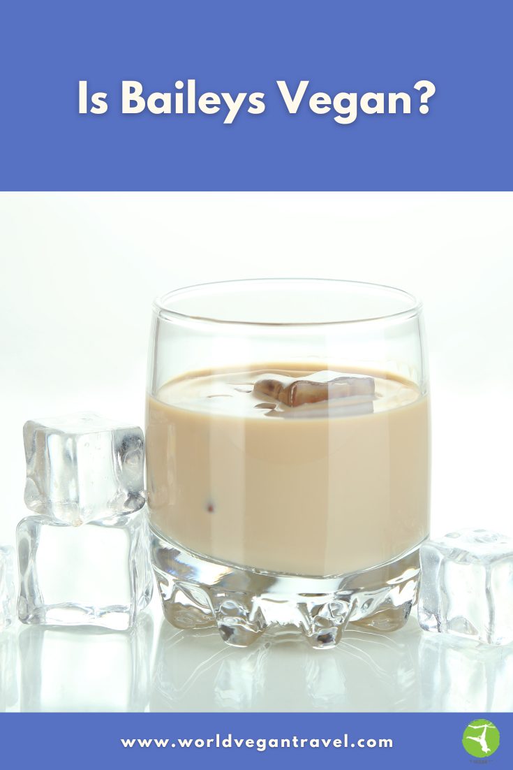 Is Baileys Vegan? | Vegan Irish Cream Alternatives | World Vegan Travel Glass of creamy Baileys-style liqueur on ice, showing what vegan Irish cream looks like.