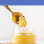 Glass jar of ghee with a spoon lifting a scoop, used for explaining whether ghee is vegan.
