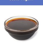 A small glass bowl filled with dark Worcestershire-style sauce on a white background, used for the World Vegan Travel blog post about vegan Worcestershire sauce.