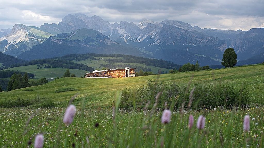 World Vegan Travel vegan hotels in Italy Paradiso Pure.Living a beautiful alpine hotel in the mountains at dusk