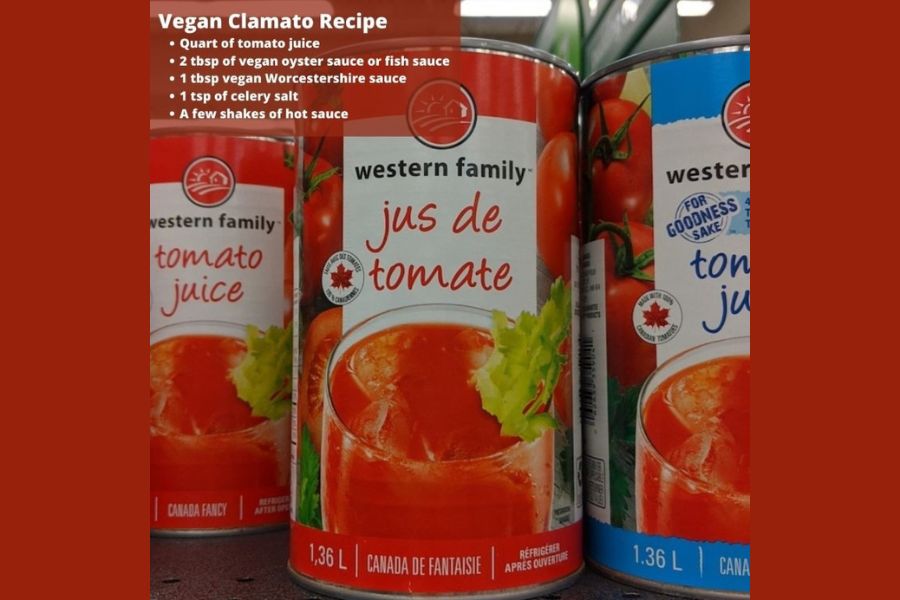 Cans of tomato juice on a shelf with a simple vegan Clamato recipe written above them.