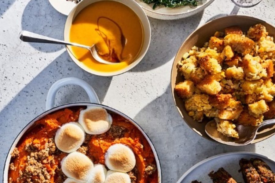 Whole Foods vegan holiday meal with sweet potato casserole, gravy, and cornbread stuffing.
