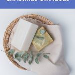 Eco-friendly soaps in a basket with eucalyptus leaves – sustainable Christmas gift ideas from World Vegan Travel.