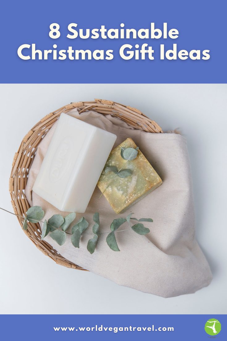 Eco-friendly soaps in a basket with eucalyptus leaves – sustainable Christmas gift ideas from World Vegan Travel.