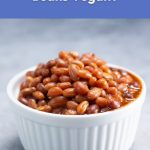 A small white bowl filled with baked beans, used for a blog post about whether baked beans are vegan.
