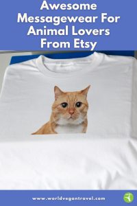 White T-shirt with a cute cat face design, part of a vegan messagewear gift guide from World Vegan Travel.