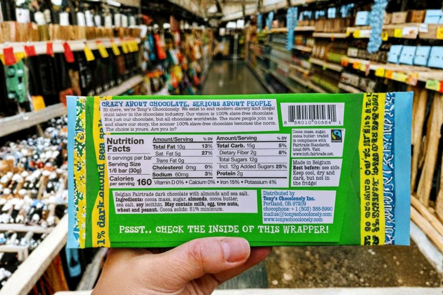 Back of a chocolate bar wrapper showing nutrition facts and a message about ethical, slave-free chocolate.