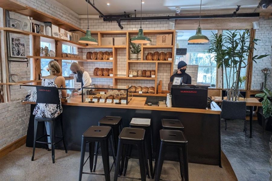 Inside Ed’s Bred vegan bakery showing fresh sourdough and pastries.