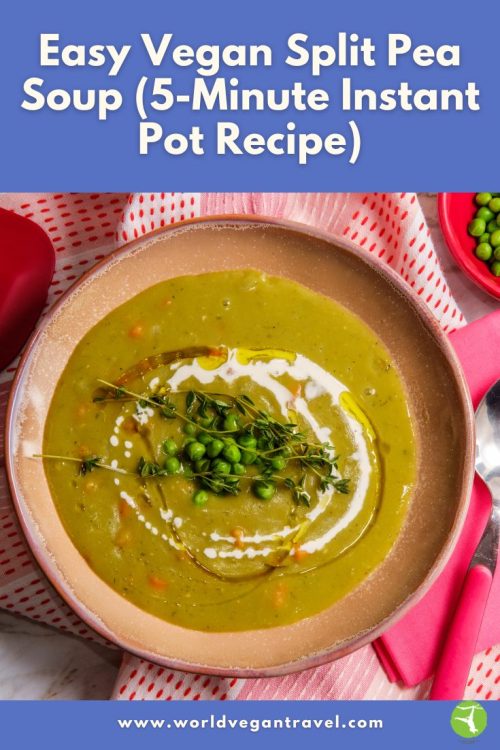A bowl of creamy vegan split pea soup topped with herbs and peas, served on a table with a pink cloth.
