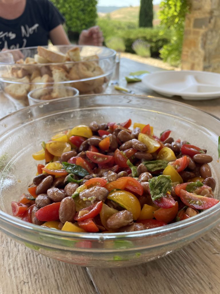 Italian tomato and bean salad in a glass bowl