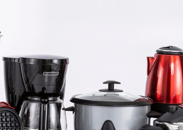 Vegan kitchen appliances including a coffee maker, rice cooker, kettle, and waffle maker – World Vegan Travel guide to essential appliances.