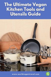 Essential vegan kitchen tools and utensils neatly arranged, including pots, frying pan, and whisks — World Vegan Travel