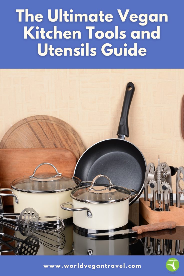 Essential vegan kitchen tools and utensils neatly arranged, including pots, frying pan, and whisks — World Vegan Travel