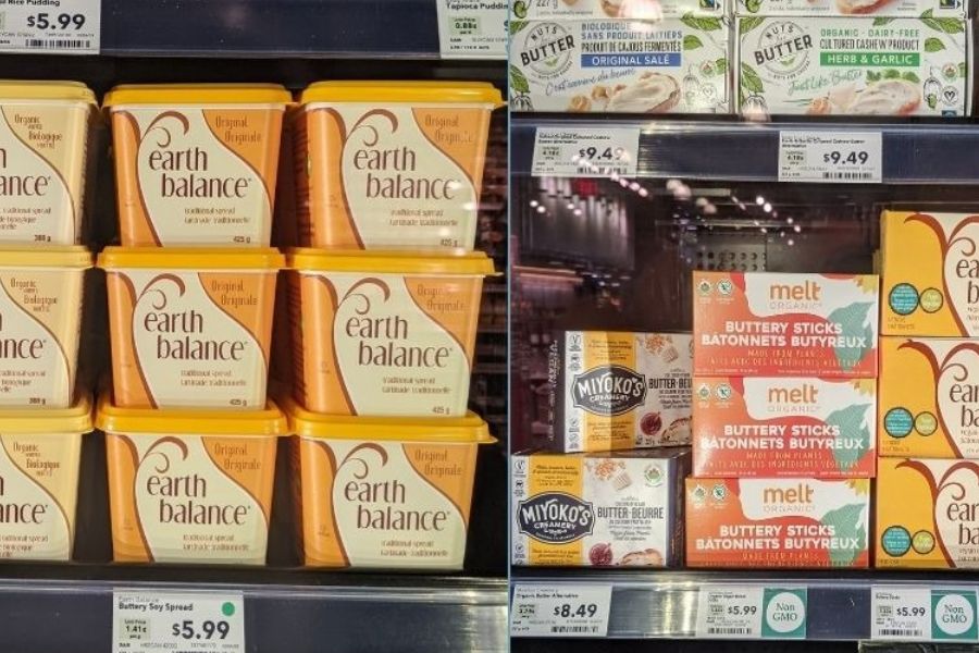 A variety of vegan butters and dairy-free spreads in a grocery refrigerator.