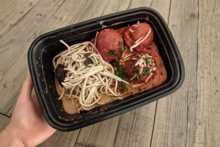 A PlantX container filled with vegan spaghetti and plant-based meatballs.