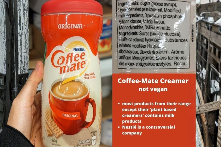 A bottle of Coffee Mate creamer with its ingredient label showing milk derivatives, alongside a note explaining that most Coffee Mate products are not vegan.
