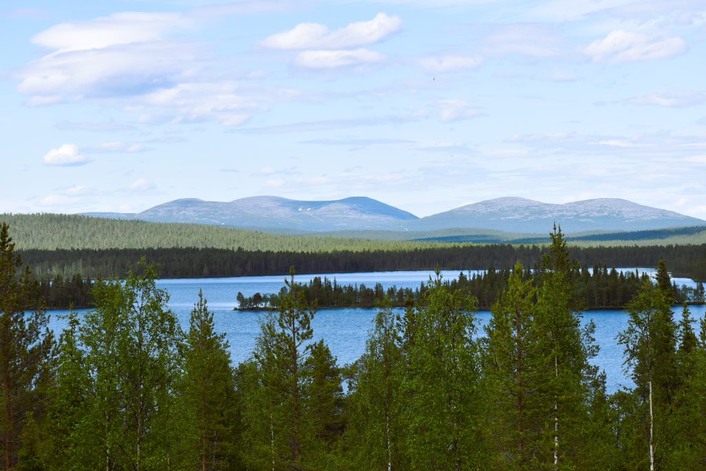 Lake with forest and mountains in Finnish Lapland.