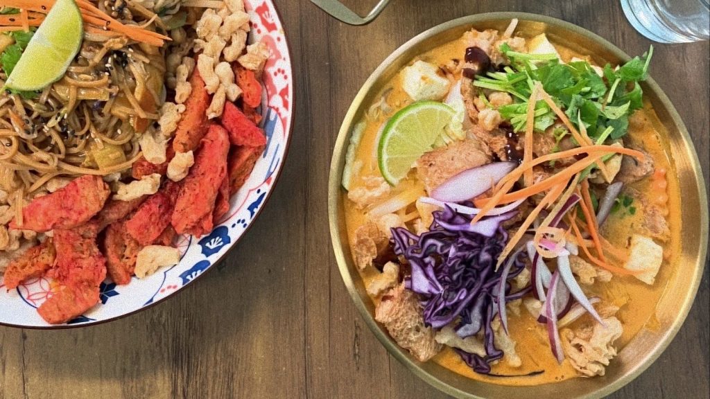 Colorful vegan Thai noodle bowls and curry in Helsinki.