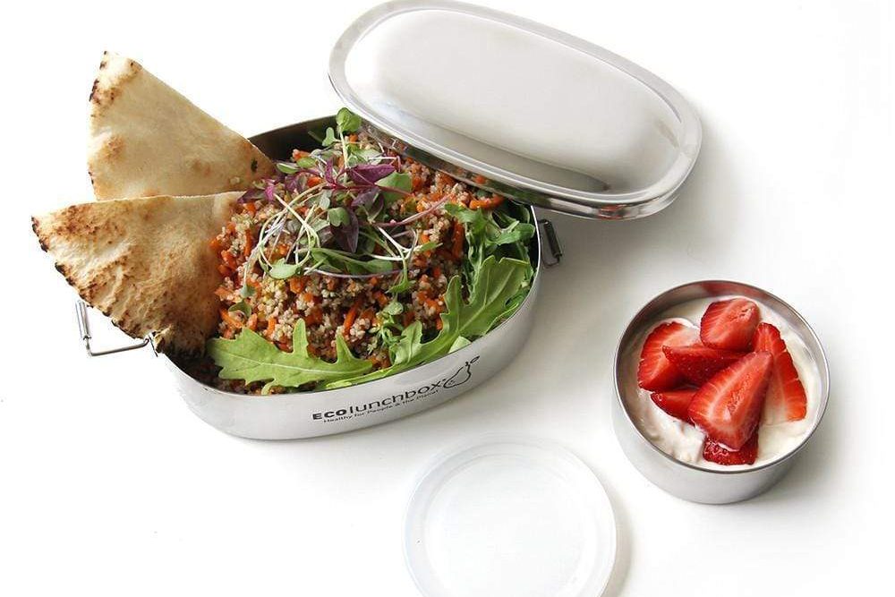 ECOlunchbox stainless steel container with salad, pita bread, and strawberries.