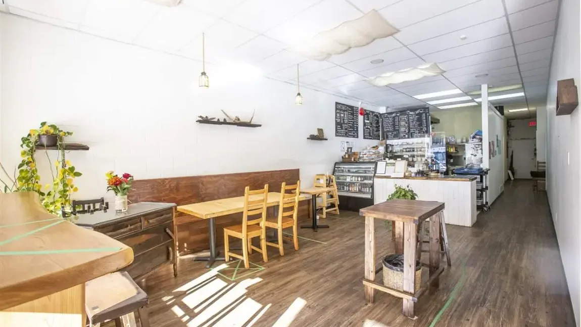 Bright cafe interior in Squamish with wooden tables and a relaxed atmosphere.