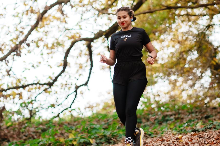 Carla running outdoors in London during autumn as part of her ultra running journey