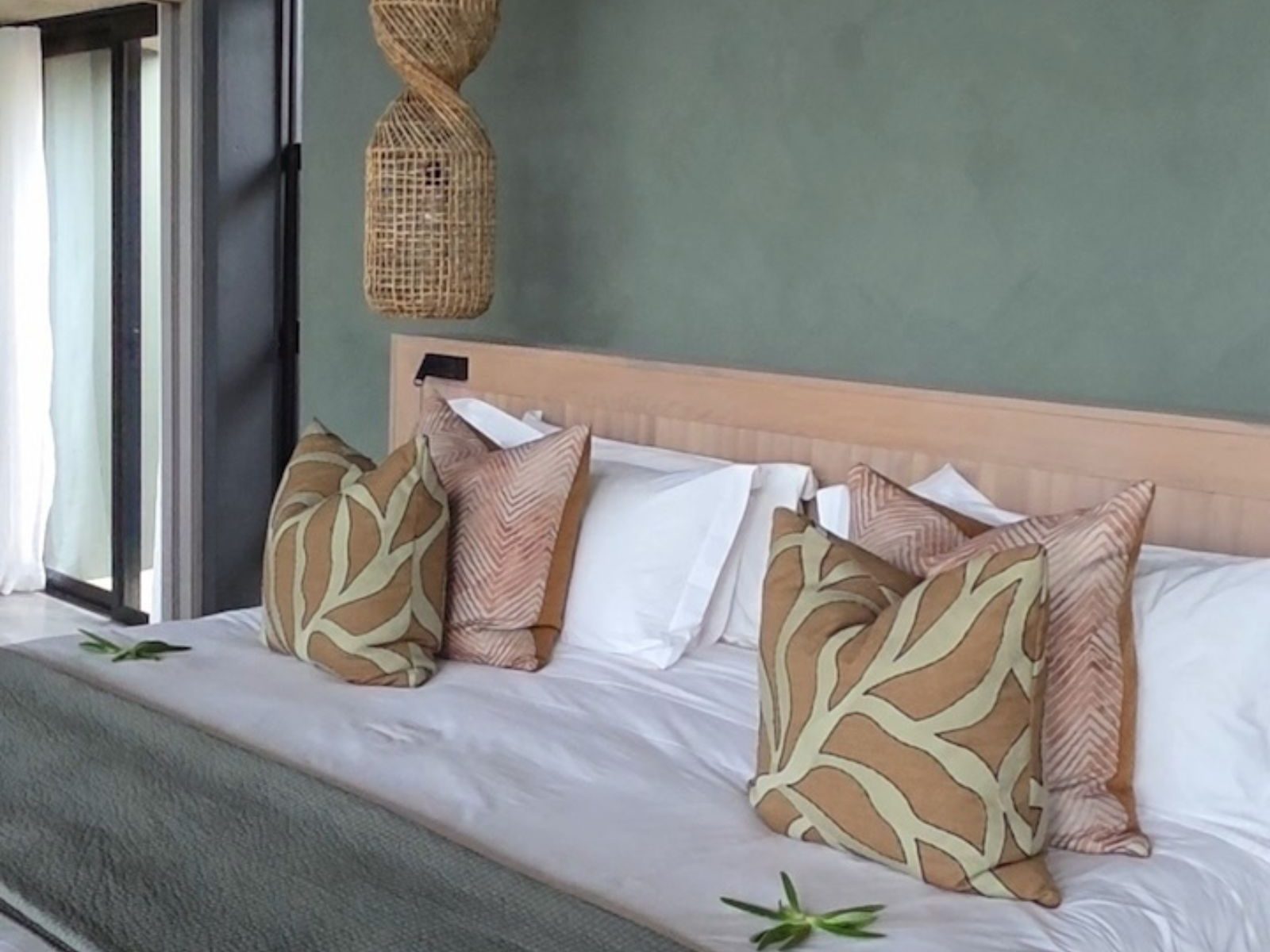 Safari lodge bedroom in Greater Kruger with soft natural colours and a calm, peaceful atmosphere