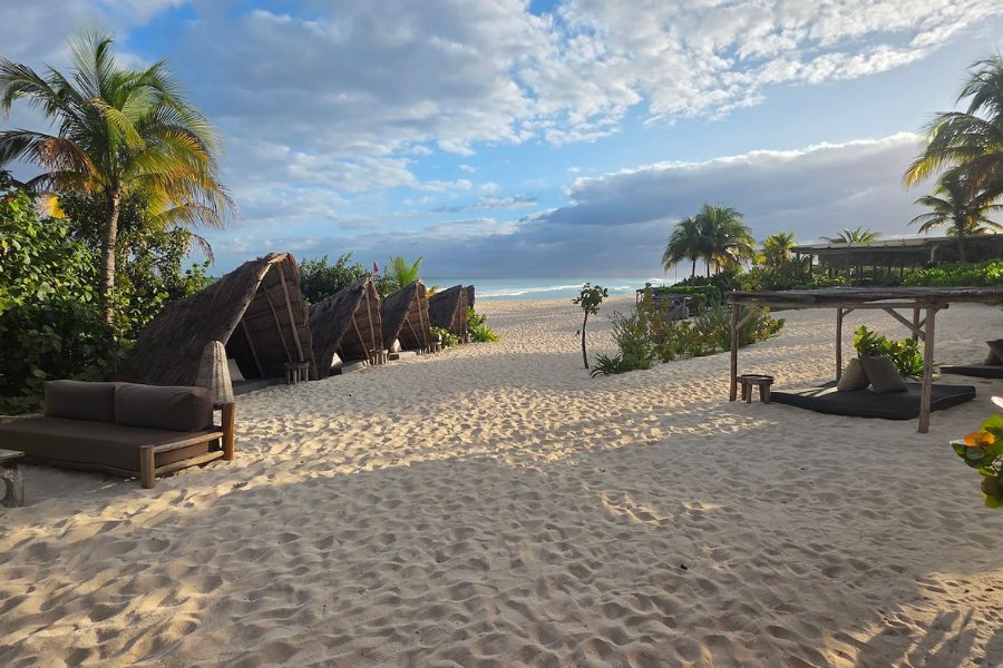 Beach lounge area at Palmaïa vegan resort in Mexico