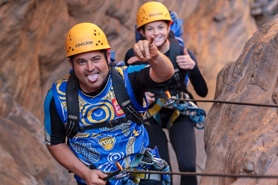 People canyoning with helmets and ropes in Karijini National Park with Spacechameleon Adventure Co